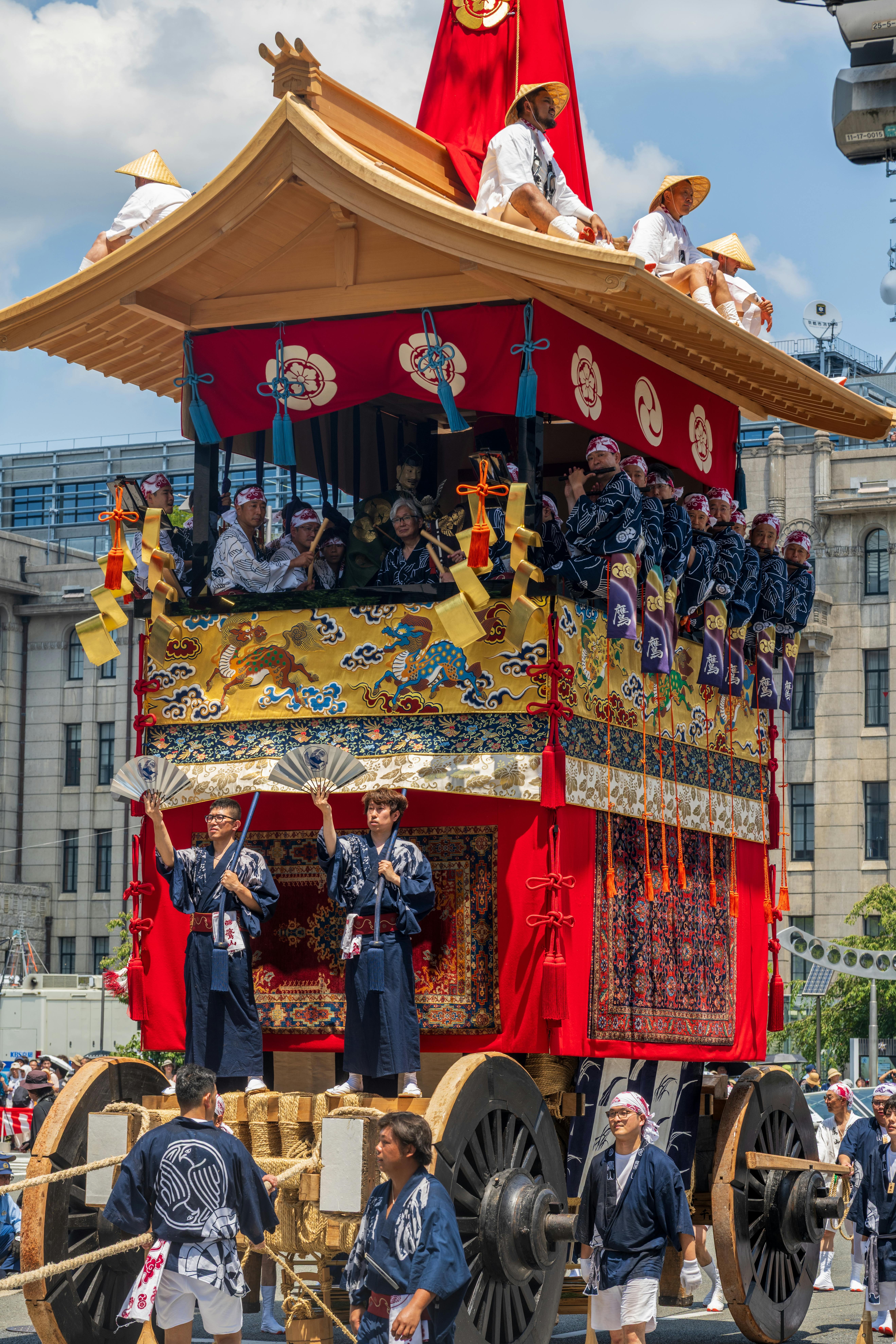 Festival procession with mikoshi and participants in traditional attire