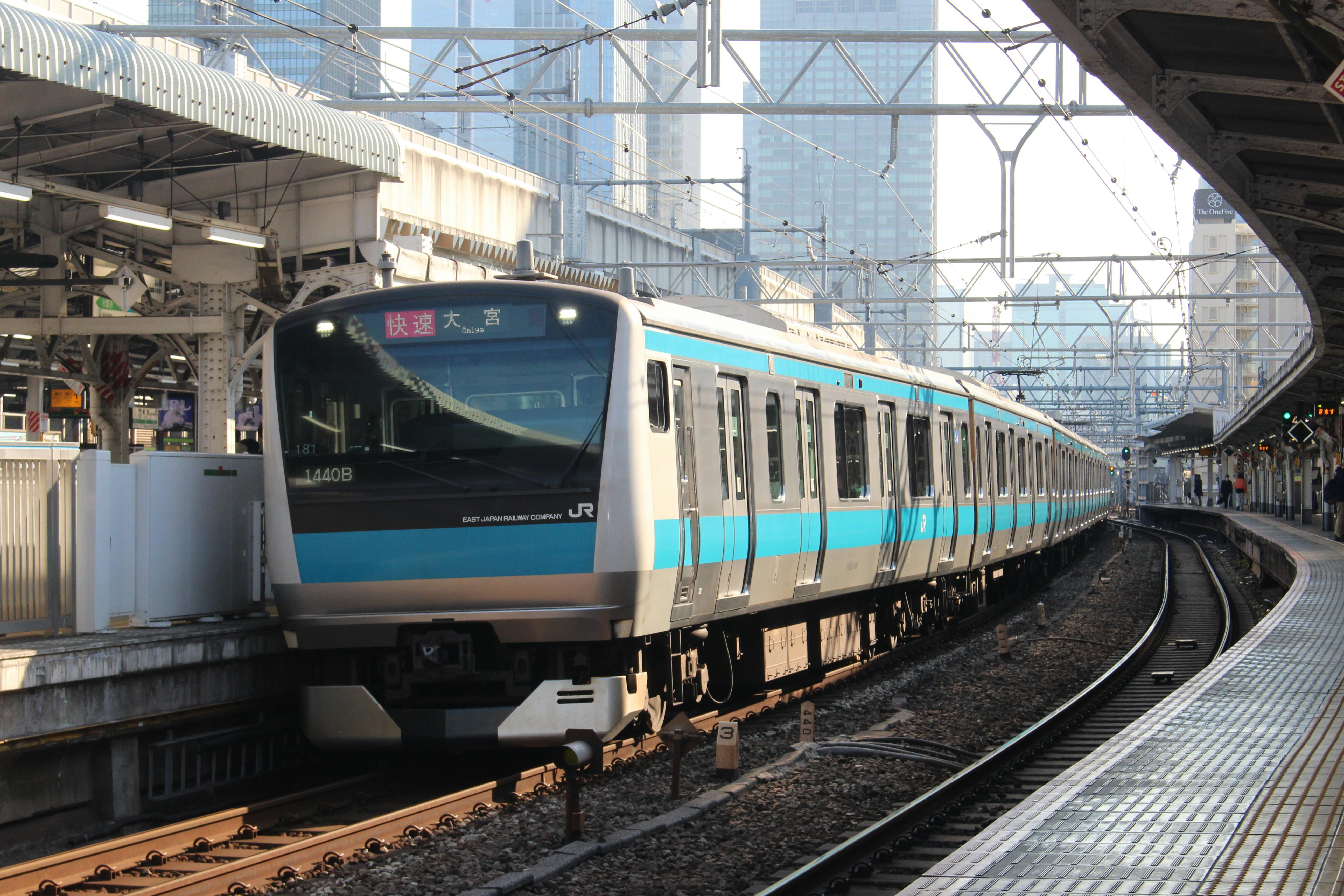 Tokyo metro platform with an arriving train